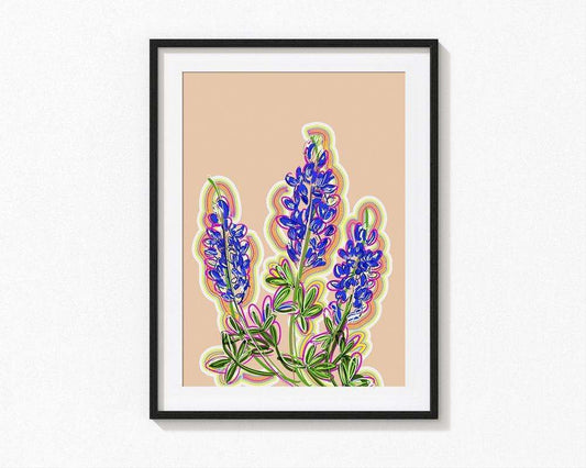 Framed bluebonnet art print with vivid purple flowers on a soft pink background, a modern Texas souvenir.