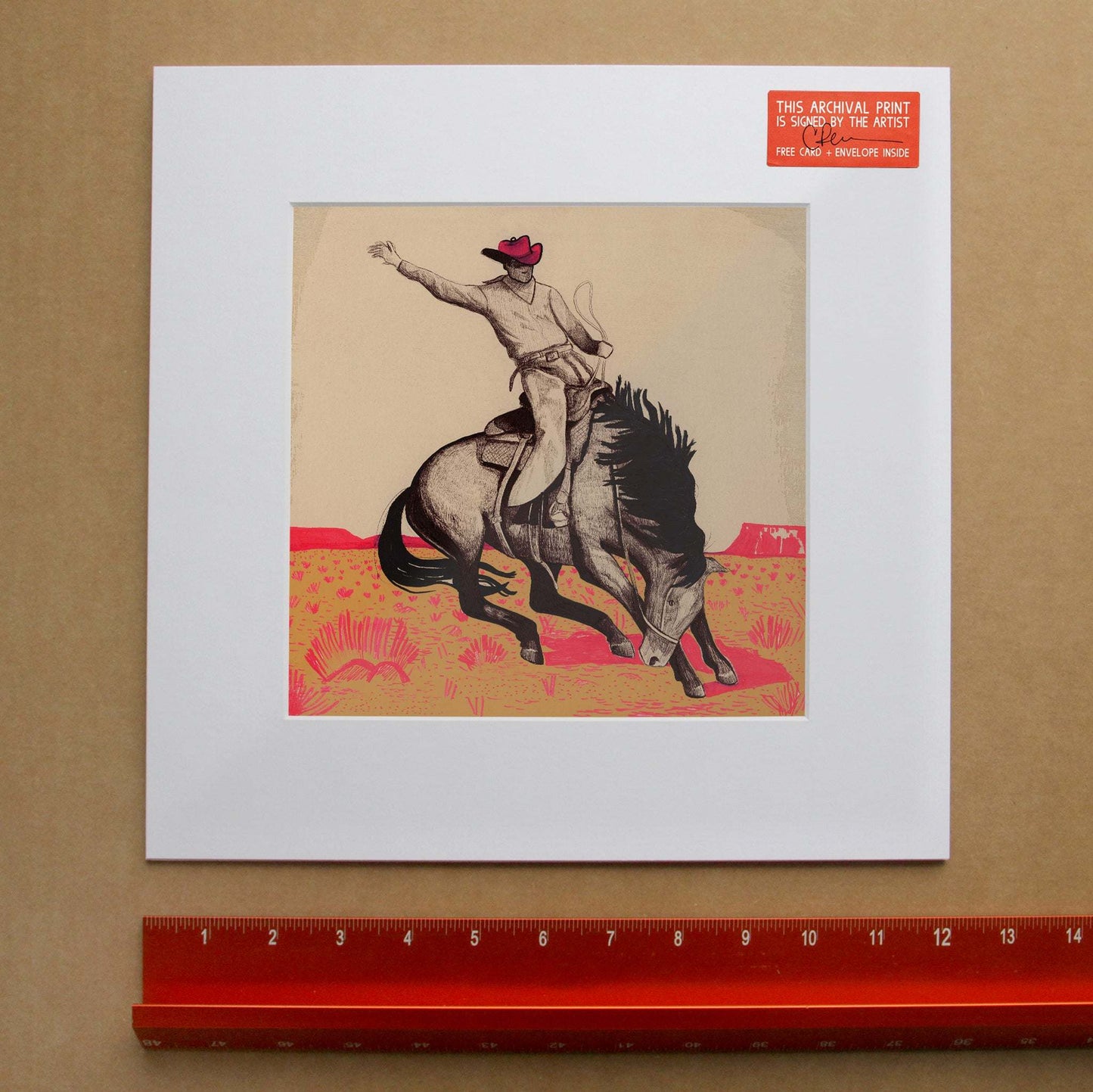 Rodeo Cowboy Bronc Buster print by Caya Crum showing cowboy riding bucking bronco in vintage western style with red and beige ink on beige background.