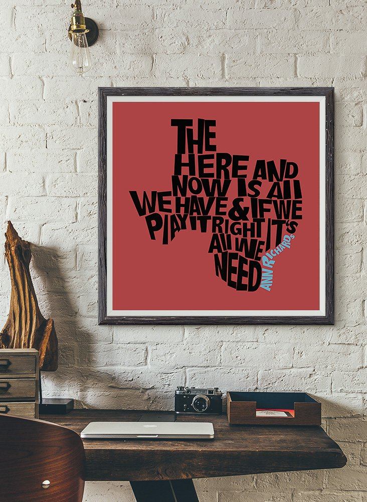 Ann Richards quote print on wall in home office setting.