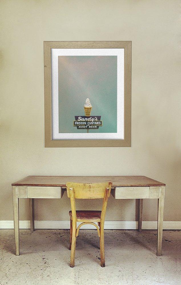 Framed Sandy's Ice Cream Austin Texas frozen custard art print above wooden desk and chair