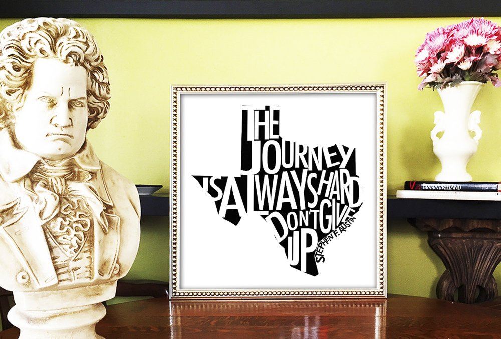 Stephen F. Austin quote art print with Texas state shape and motivational text "The Journey is Always Hard, Don't Give Up" displayed in a decorative frame.