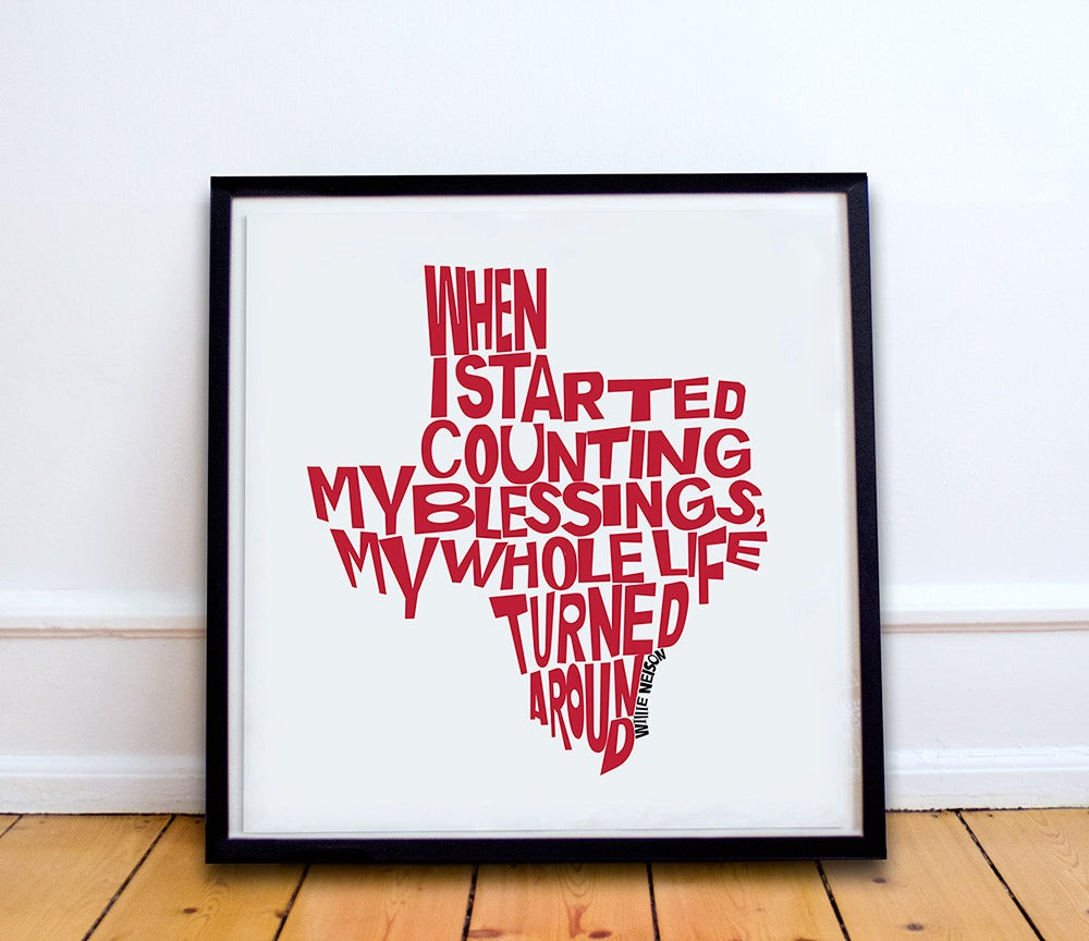 Framed Willie Nelson Quote wall art print with red text shaped like Texas reading "When I started counting my blessings my whole life turned around"