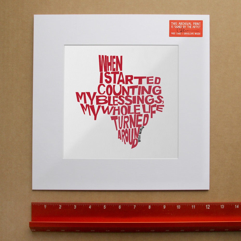 Willie Nelson Quote art print shaped like Texas, red typography on white background, signed by artist Betsy Crum