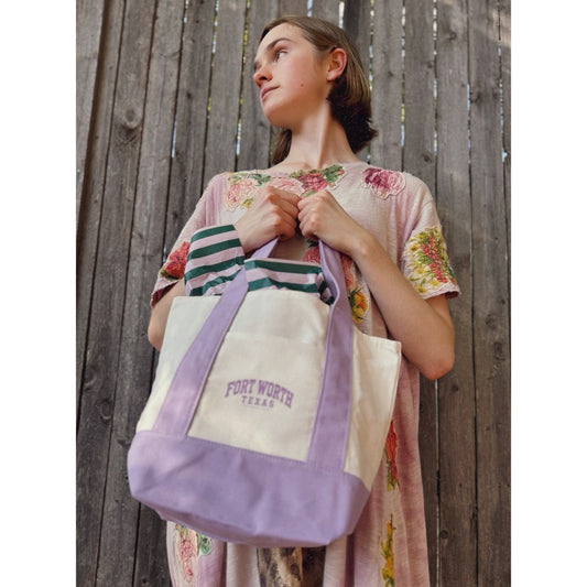 Fort Worth Texas lavender canvas boat tote by Crum Art, carried by the handles