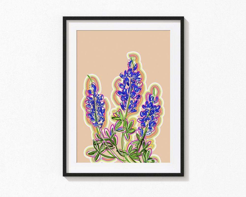 Framed bluebonnet art print with vivid purple flowers on a soft pink background, a modern Texas souvenir.