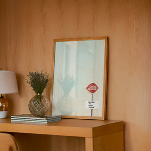 Dairy Queen Big Texas Sky Texas art print by Betsy Crum — framed in a wood-accent room