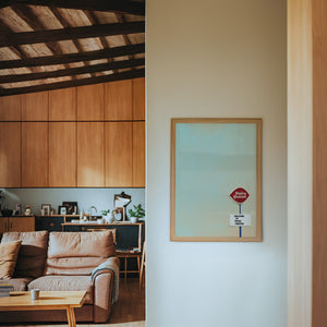 Dairy Queen Big Texas Sky Texas art print by Betsy Crum — framed in a wood-accent room