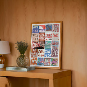 Alphabet of Austin Austin Art print by Betsy Crum — framed in a wood-accent room