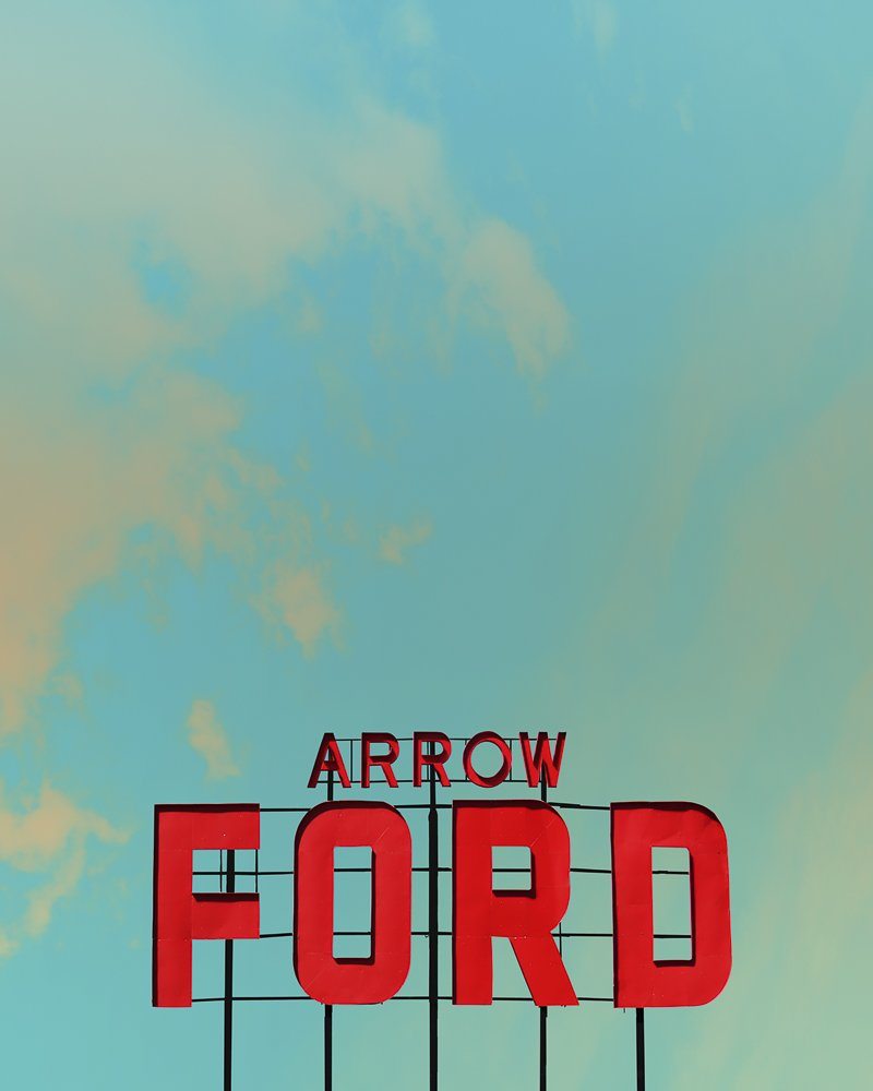 Abilene Art . Arrow Ford Abilene Texas sign against a West Texas sky in a vintage style museum print