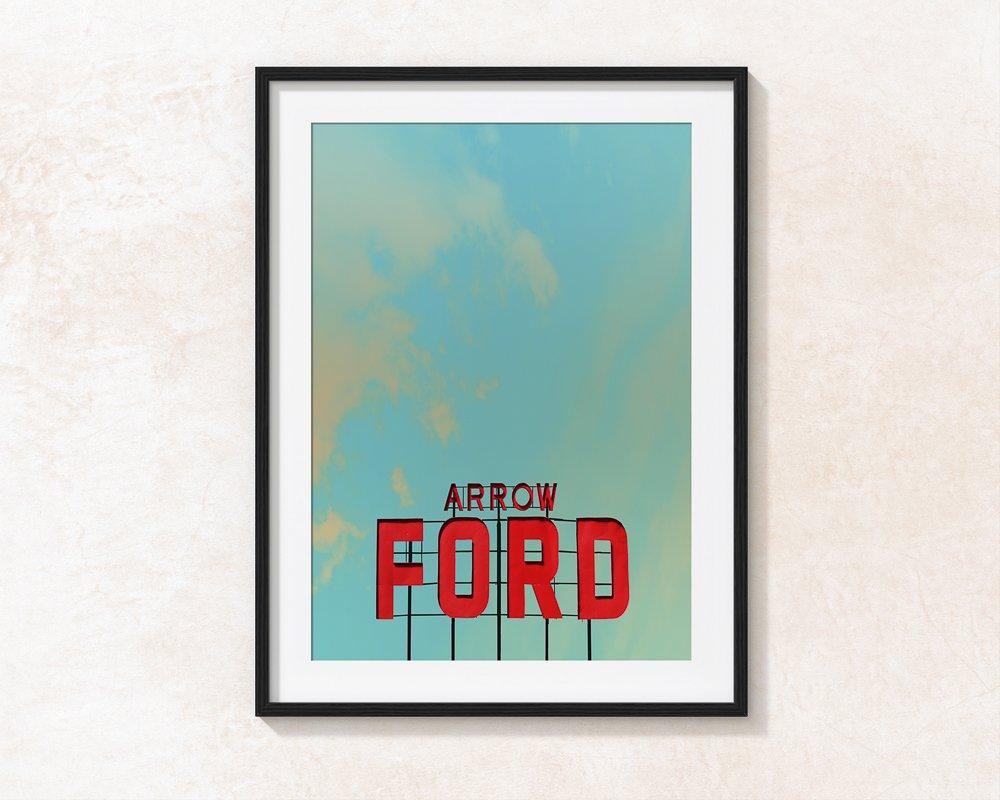 Abilene Art . Arrow Ford Abilene Texas sign against a blue West Texas sky museum print in black frame
