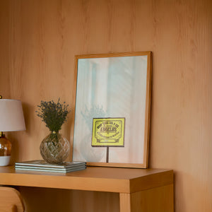 Angelo's BBQ Fort Worth art print by Betsy Crum — framed in a wood-accent room