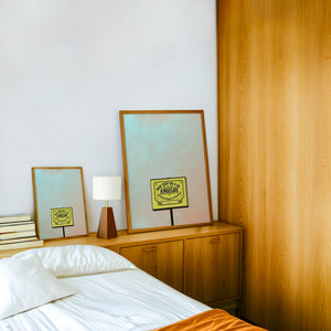 Angelo's BBQ Fort Worth art print by Betsy Crum — framed in a wood-accent room