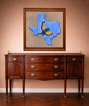 Banana Taped to Texas print framed in a western room by Caya Crum — funny Texas wall art from Crum Art, made in Fort Worth.