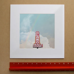 Austin Movie Lover Wall Art by Betsy Crum, inspired by the South Lamar Alamo Drafthouse sign, soft cloud color, and the kind of Austin film culture nostalgia that gives this print real local character, available at crumart.com. This museum quality print is made right here in Texas.
