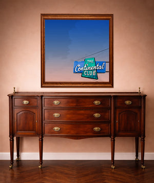 Continental Club Austin art print by Betsy Crum framed in a western styled room