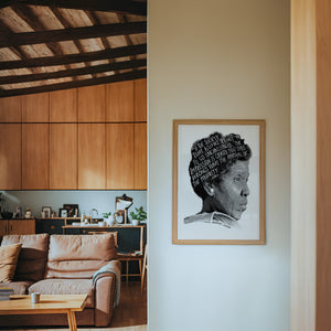 Barbara Jordan Texas art print by Betsy Crum — framed in a wood-accent room