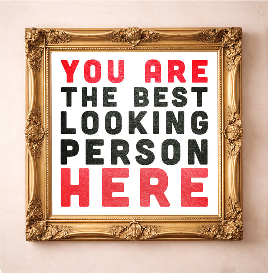 "You Are the Best Looking Person Here", Artr Print by Carl Crum, a matted archival art print in a gold frame inspired by bold typography, playful confidence, and the extra reassurance you didn’t know you needed, available at crumart.com. This museum quality print is made right here in Texas.