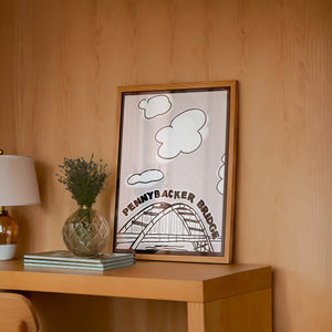 Pennybacker 360 Bridge Austin print by Betsy Crum — framed in a wood-accent room