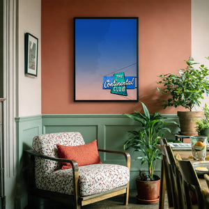 Austin Continental Club art print by Betsy Crum framed above a dresser, big Texas sky wall art