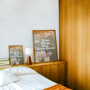 Austin Forever Tower Austin Art print by Betsy Crum — framed in a wood-accent room