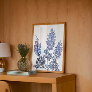 Chinoiserie Line bluebonnet art print by Betsy Crum — framed in a wood-accent room