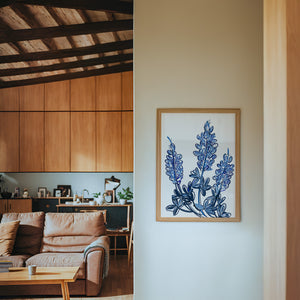 Chinoiserie Line bluebonnet art print by Betsy Crum — framed in a wood-accent room