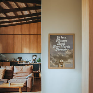 Fort Worth Forever art print by Betsy Crum — framed in a wood-accent room