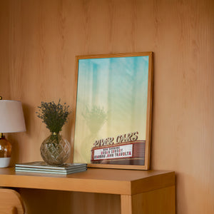River Oaks Theatre Houston art print by Betsy Crum — framed in a wood-accent room