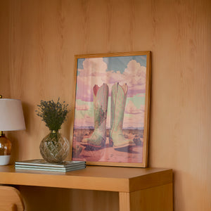 Marfa Boots cowboy boot print by Betsy Crum — framed in a wood-accent room
