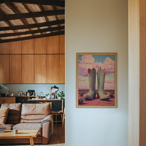 Marfa Boots cowboy boot print by Betsy Crum — framed in a wood-accent room