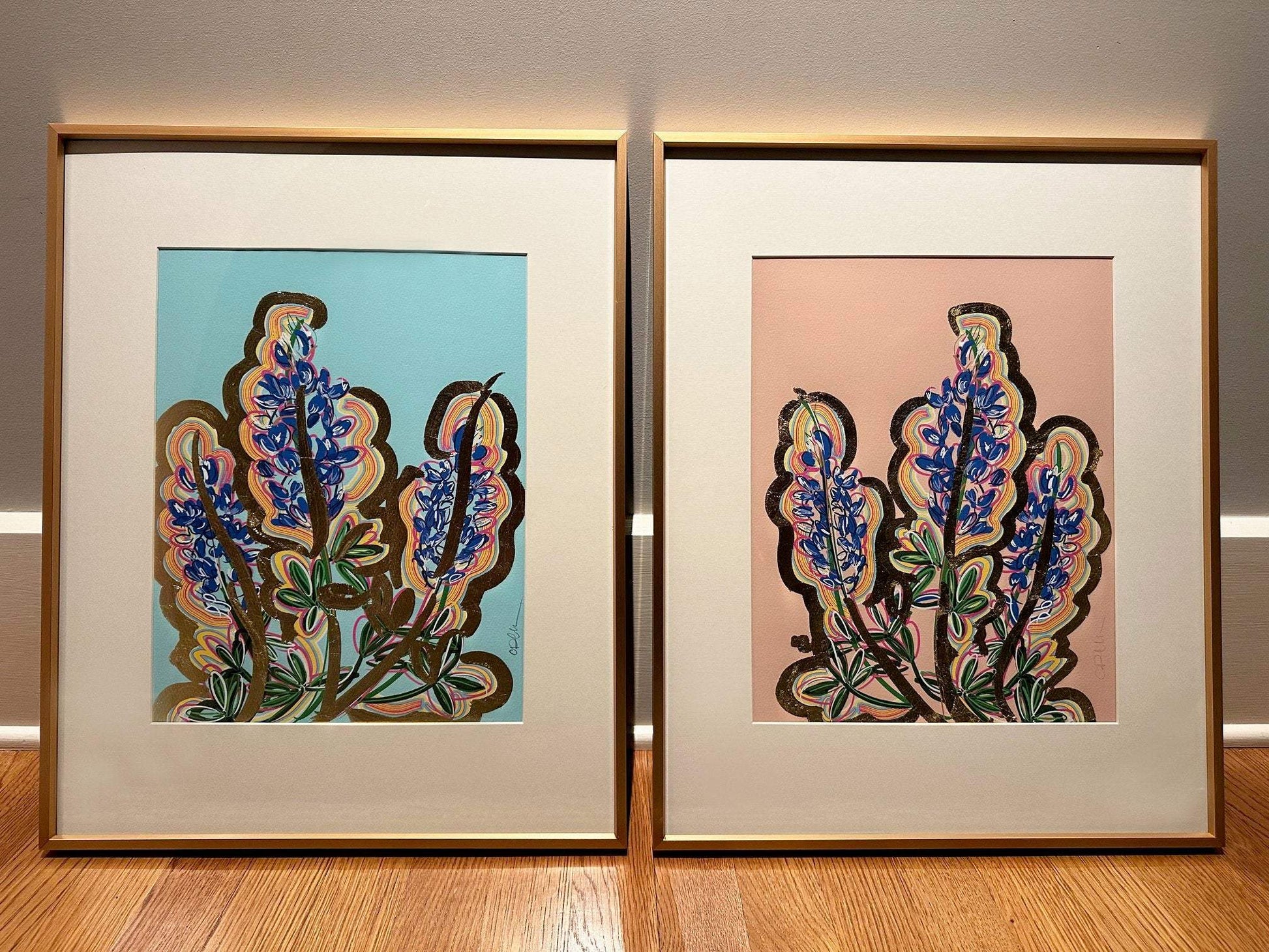 Blue Bonnet Art Print - Framed Texas Blue Bluebonnet Art Print art by Betsy Crum with colorful floral designs on blue and pink backgrounds