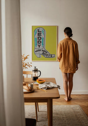 Chartreuse Leddy boot print by Betsy Crum adding a pop of color to a neutral wall