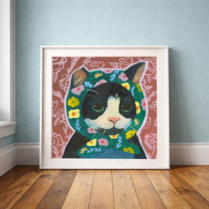 Little Mama tuxedo cat art print by Caya Crum, green-eyed cat with floral headscarf, shown in a neutral room