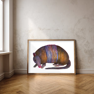 Watercolor armadillo art print by Caya Crum — nine-banded Texas armadillo in purple and brown, framed 16x20