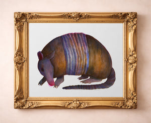 Watercolor Armadillo art print by Caya Crum — in a gold frame
