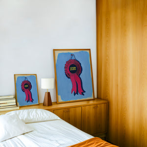 Best in Show Scum Ribbon funny wall art print by Caya Crum — framed in a wood-accent room