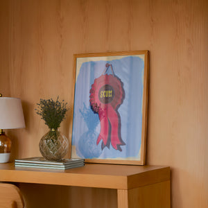 Best in Show Scum Ribbon funny wall art print by Caya Crum — framed in a wood-accent room