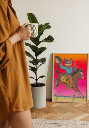 Cat Cowboy Bronco cat art print by Caya Crum — framed with velvet mat