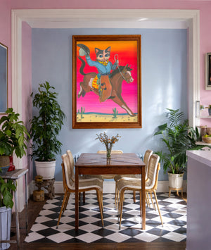 Cat Art Print by caya crum in a maximalist but modern setting. This smoking cowboy cat wall decor is ideal for the person who loves cats and quirky art.  24x36" print, fits into a standard size frame, signed by the artist.  Bold desert colors, cowboy style wall art.