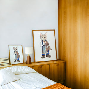Frankie Fish Cat art print by Caya Crum — framed in a wood-accent room