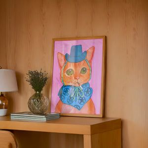 Fluffy Angel Cat art print by Caya Crum — framed in a wood-accent room