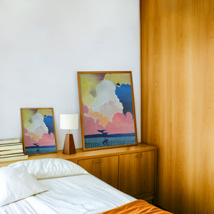 Cosmic Cowboy UFO Desert cowboy art print by Caya Crum — framed in a wood-accent room