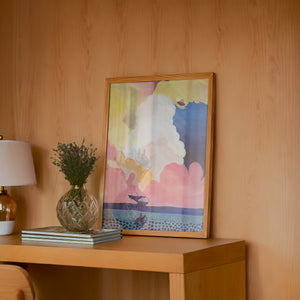 Cosmic Cowboy UFO Desert cowboy art print by Caya Crum — framed in a wood-accent room