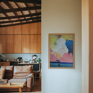 Cosmic Cowboy UFO Desert cowboy art print by Caya Crum — framed in a wood-accent room