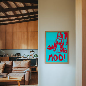 The Judy's Moo Cassette (blue and red) music wall art print by Betsy Crum — framed in a wood-accent room