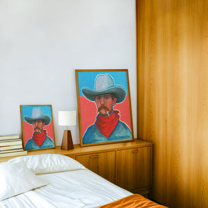 Red Hair Jack cowboy art print by Caya Crum — framed in a wood-accent room