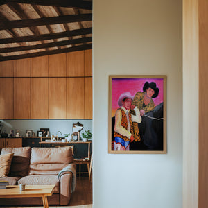 The Cowboy Gaze cowboy art print by Caya Crum — framed in a wood-accent room