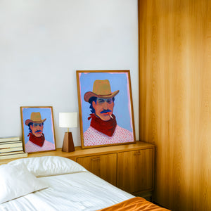Wade cowboy art print by Caya Crum — framed in a wood-accent room