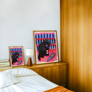 Neon Raccoon Dr Pepper art print by Caya Crum — framed in a wood-accent room