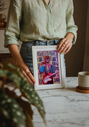 Bowie Ashes to Ashes music wall art print by Caya Crum — neutral frame room mockup